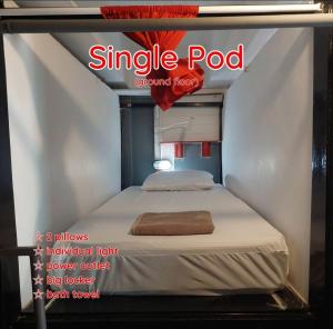 a magazine cover of a single pod with a bed at Dormsin Chill in Phi Phi Islands +4 photos