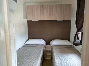 A bed or beds in a room at Garda Di Vino Agricamping & Wine Shop Lazise