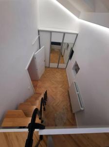 a room with a staircase in a house at Buda-city house in Trnávka