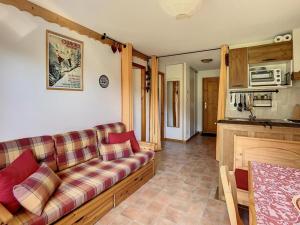 a living room with a couch and a kitchen at Appartement Le Biot, 3 pièces, 4 personnes - FR-1-573-115 in Le Biot