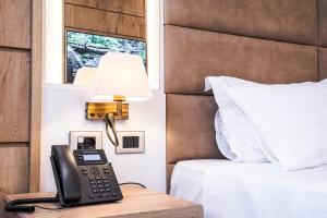 Postel nebo postele na pokoji v ubytování Amfora Hotel & Spa