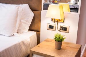 Postel nebo postele na pokoji v ubytování Amfora Hotel & Spa