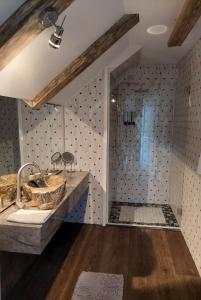 a bathroom with a sink and a shower at Quiet place in Kaunas