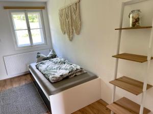 Postel nebo postele na pokoji v ubytování Lendorfer Cottage