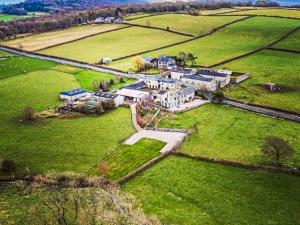 an aerial view of a large house in a field at Keepers Lodge - Uk38042 in Beetham