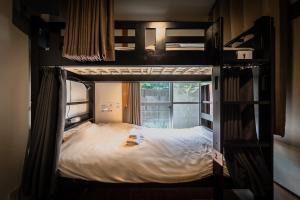 Postel nebo postele na pokoji v ubytování Wabi Sabi Hostel