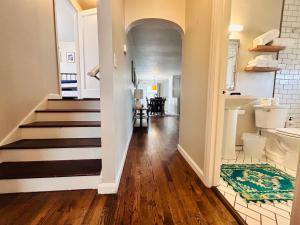 a hallway of a home with a staircase and a room at Celebration Chalet! Quant, cozy, a few blocks from BSU and close to downtown Boise, Fireplace, 4 beds, and seating for 6 Pets Welcome! in Boise +20 photos
