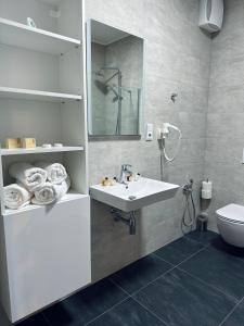 a bathroom with a sink and a toilet at ANPELA in Rýmařov