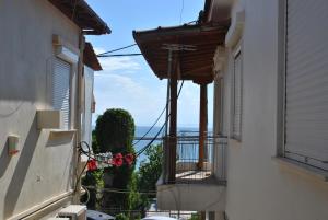 a view from an alley between two buildings at HARBOUR ROOMS in Nea Michaniona