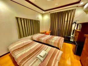 Postel nebo postele na pokoji v ubytování Wabi Sabi Hostel