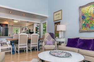 a living room with a couch and a table at 2465 Racquet Club Villa in Seabrook Island