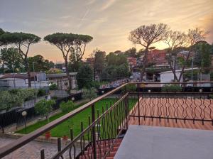 a view from a balcony of a street with trees at Belvedere Rooms Guest House in Rome