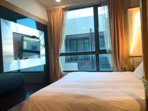 Letto o letti in una camera di Happiness Inn