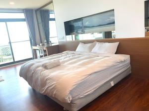 Letto o letti in una camera di Happiness Inn