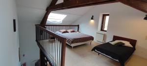 Postel nebo postele na pokoji v ubytování Gîte familial de la Bastide du puech