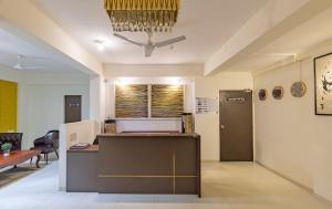 an office with a reception desk and a table at Hotel Reemz Beach Heaven , Anjuna in Anjuna