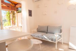 a living room with a couch and a table at Villa Valentina 250m From The Beach - Happy Rentals in Puntaldia