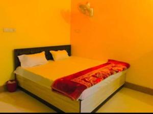 מיטה או מיטות בחדר ב-OYO 81347 Amantran Hotel And Restaurant