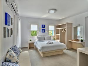 Postel nebo postele na pokoji v ubytování Bedspot Apartments Paros