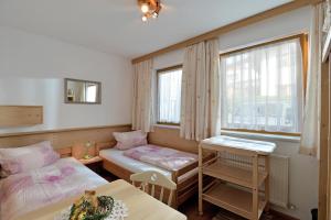 Posteľ alebo postele v izbe v ubytovaní Ferienhaus Siglinde