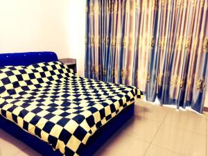 Postel nebo postele na pokoji v ubytování EZHomestay Platinum near Cyberjaya Putrajaya KLIA