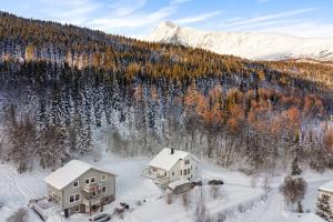 an aerial view of a house in the snow at Main floor in the Lyngen Alps, whole house rentable in Lyngseidet +49 photos