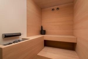 a small sauna with wooden walls and wooden shelves at Áurea Casa Palacio Sagasta by Eurostars Hotel Company in Cádiz