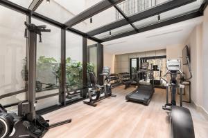 a gym with treadmills ellipticals and treadleys at Áurea Casa Palacio Sagasta by Eurostars Hotel Company in Cádiz