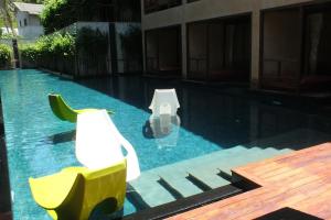 a swimming pool with a toilet in the middle of a building at Avatar Railay in Railay Beach