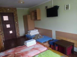 Posteľ alebo postele v izbe v ubytovaní Zajazd u Lecha Pokoje Sucha Rzeczka 3b Kuchnia Regionalna i Lytewska