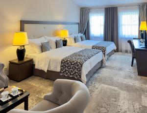 Posteľ alebo postele v izbe v ubytovaní Metropolitan Boutique Hotel + 32 fotografií