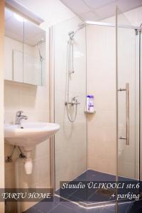 a bathroom with a shower and a sink at University City Heart, Tartu Home in Tartu