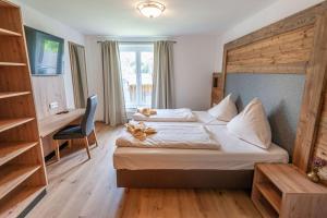 Ένα ή περισσότερα κρεβάτια σε δωμάτιο στο Ferienwohnung Grundlsee