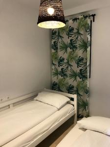 A bed or beds in a room at Spacious Apartment with Views in Málaga, 77 m², Shared Pool