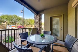 a patio with a table and chairs on a balcony at Pet-Friendly Phoenix Condo with Community Amenities in Phoenix