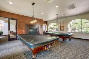 a large room with two pool tables in it at Pet-Friendly Phoenix Condo with Community Amenities in Phoenix