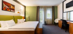 Voodi või voodid majutusasutuse Hotel Vécsecity toas