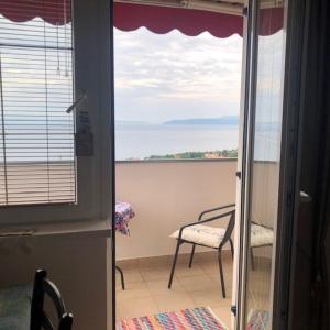 a view of the ocean from a room with a window at Studio Apartment Blue Dream in Ičići