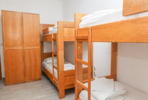 a room with bunk beds in a dorm room at HI Hostel Zadar in Zadar