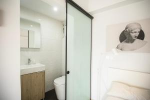 a bathroom with a toilet and a sink at Sky-view Hideaway in Nicosia +28 photos