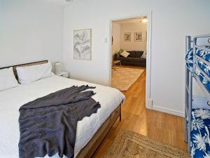 a bedroom with a bed and a living room at Sea Salt at Stansbury Apartment 1 in Stansbury