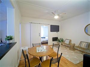 a living room with a table and chairs and a room at Sea Salt at Stansbury Apartment 1 in Stansbury