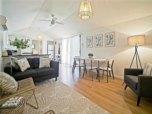 a living room with a couch and a table at Sea Salt at Stansbury Apartment 3 in Stansbury