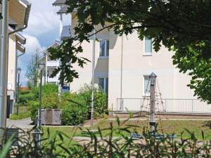 a building with a water tower in front of it at Wohnpark Stadt Hamburg - Apt. 46 in Binz