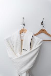 a white shirt is hanging on a hanger at Number 59 - Irish Stay Group in Dublin