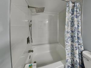 a bathroom with a shower and a toilet at Madeira Beach Yacht Club 261f in St Pete Beach