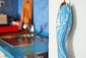 a close up of a blue and white object on a wall at Nautic in Quarteira