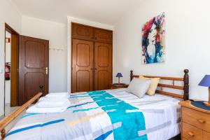 Ένα ή περισσότερα κρεβάτια σε δωμάτιο στο Apartamento Mantamar 9T1 by ALGARVEMANTA