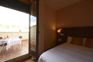 Postel nebo postele na pokoji v ubytování Hotel Campos de Castilla