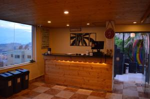 a bar in a restaurant with a view at Rafiki Hostel in Wadi Musa